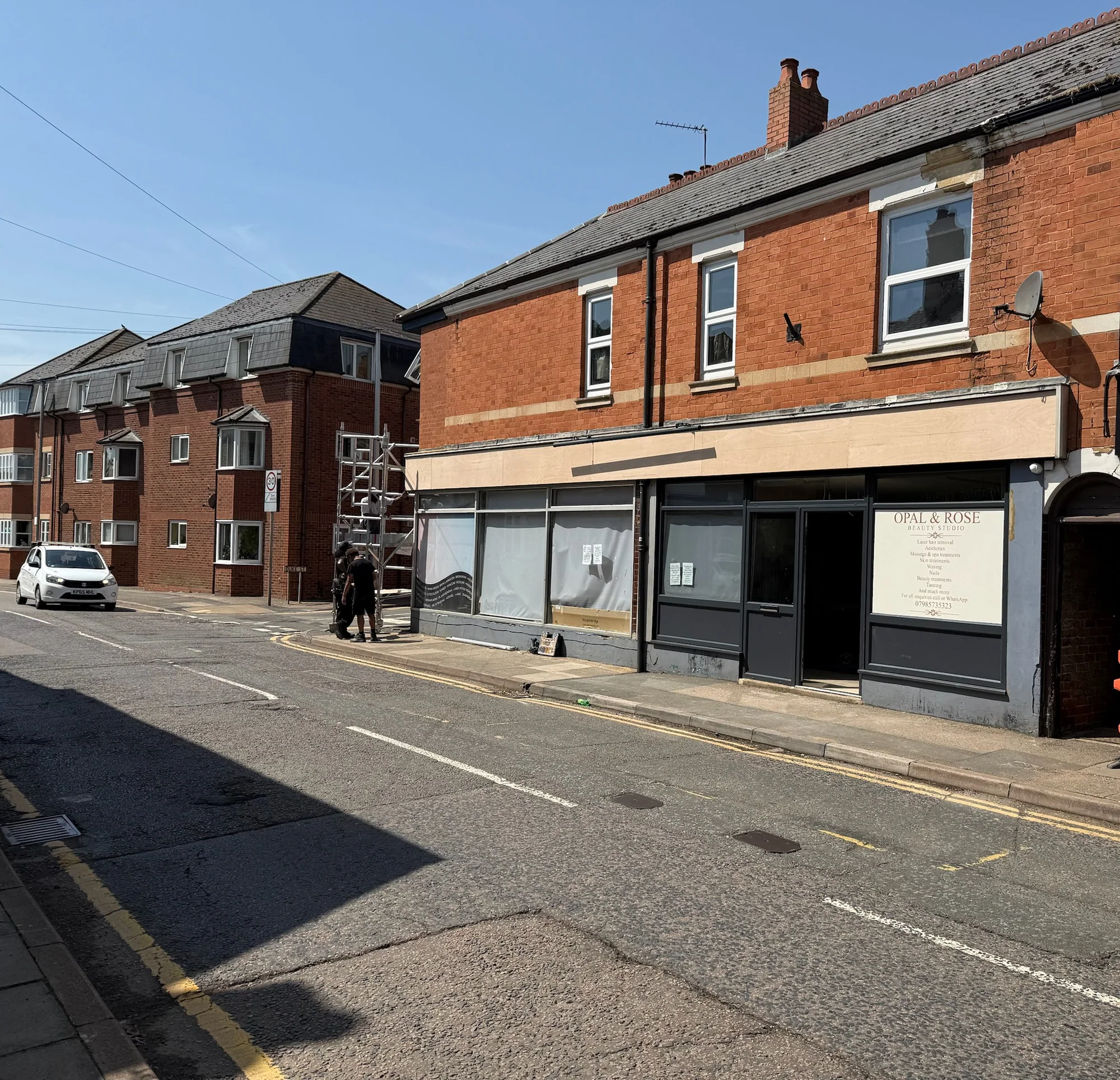 Opal and Rose shopfront with the old fascia removed and timber substrate exposed