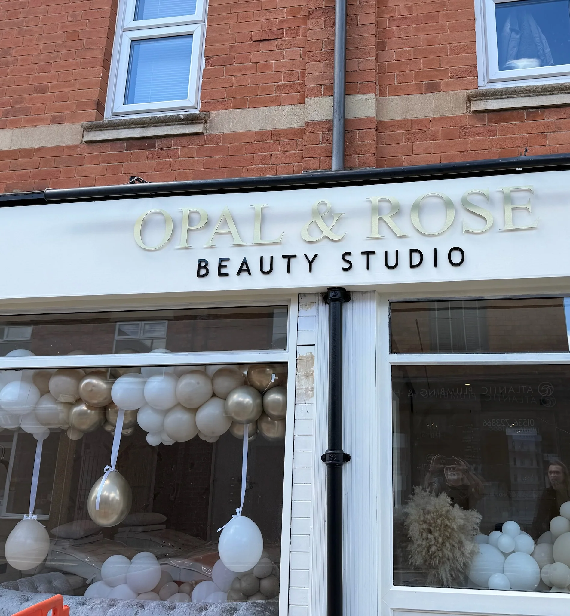 Finished Opal and Rose fascia lettering above the decorated shop window