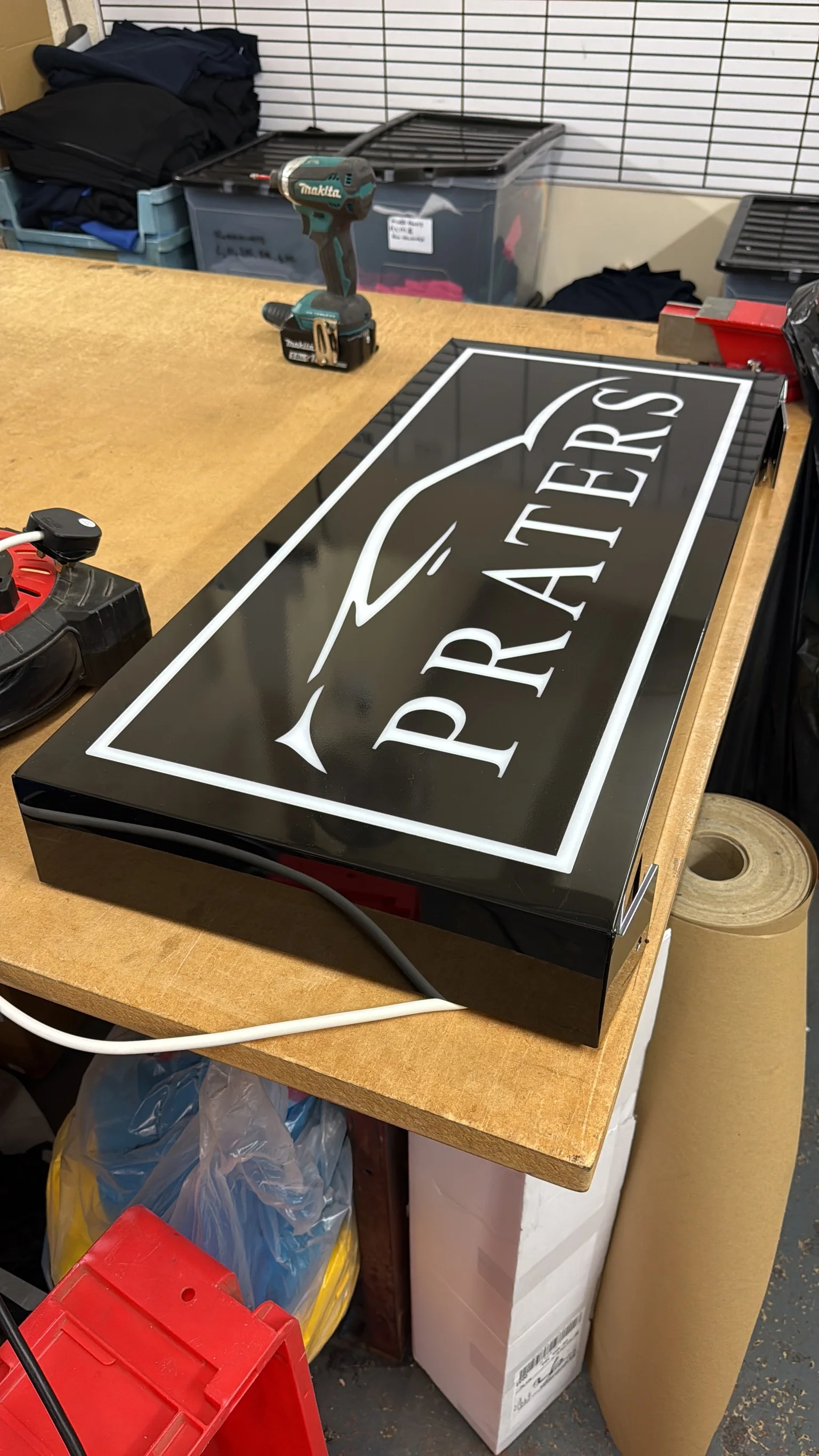 Black Praters illuminated sign box being assembled in The Sign Hub workshop